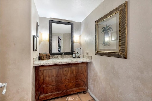 bathroom with tile patterned flooring and vanity