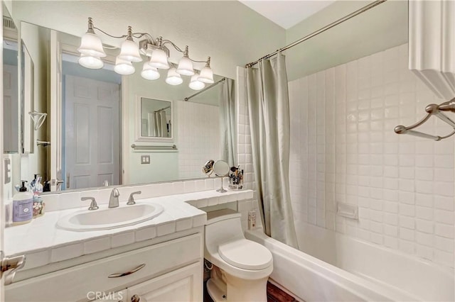 full bathroom with vanity, shower / bath combination with curtain, and toilet