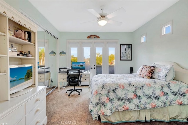 carpeted bedroom with access to outside and ceiling fan