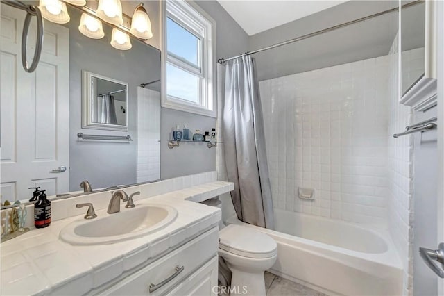 full bathroom featuring shower / bath combo with shower curtain, vanity, and toilet