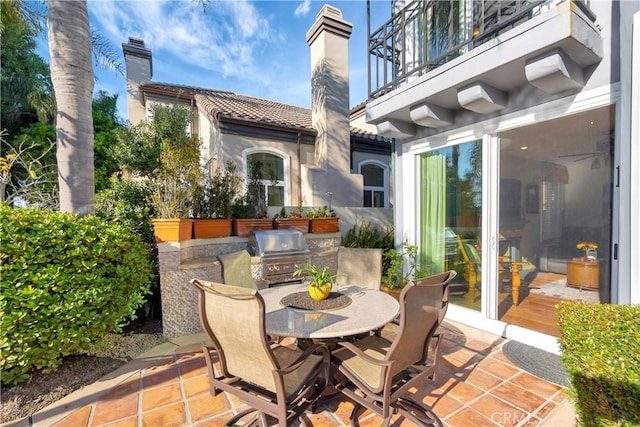 view of patio / terrace featuring a balcony and a grill