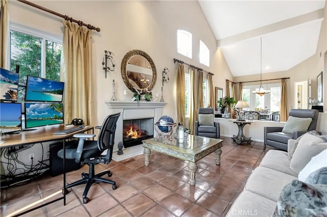 interior space with a wealth of natural light, high vaulted ceiling, and an inviting chandelier