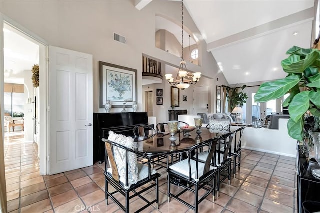 dining area with tile patterned flooring, high vaulted ceiling, and a notable chandelier