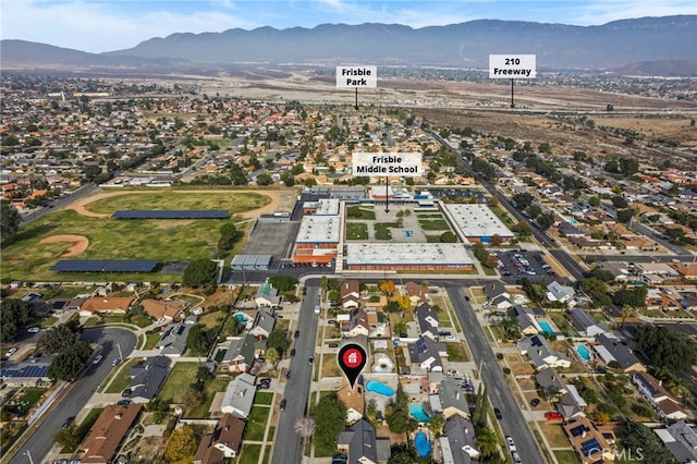 birds eye view of property featuring a mountain view