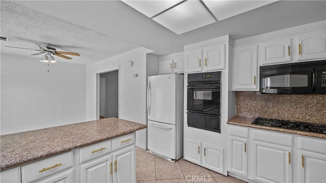 kitchen with stainless steel gas stovetop, decorative backsplash, white refrigerator, and white cabinetry