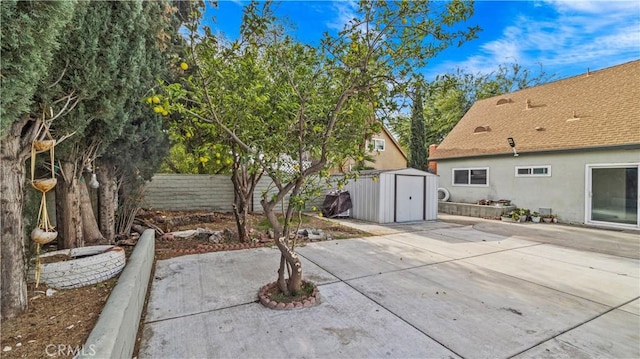 view of patio / terrace with a shed