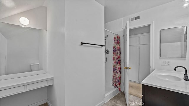 bathroom featuring vanity and walk in shower