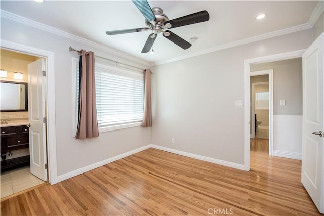 unfurnished bedroom with ensuite bathroom, ceiling fan, light wood-type flooring, and crown molding