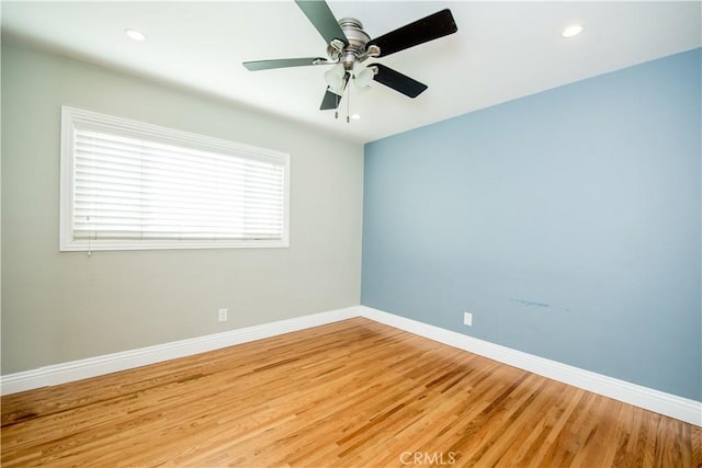 empty room featuring ceiling fan and wood-type flooring