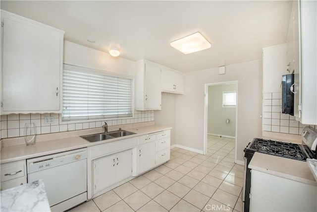 kitchen with white cabinets, white appliances, sink, and tasteful backsplash