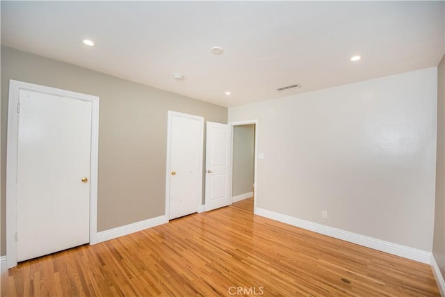 unfurnished bedroom with light hardwood / wood-style floors