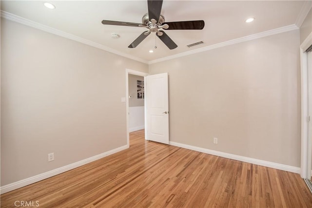 unfurnished room featuring crown molding, ceiling fan, and light wood-type flooring