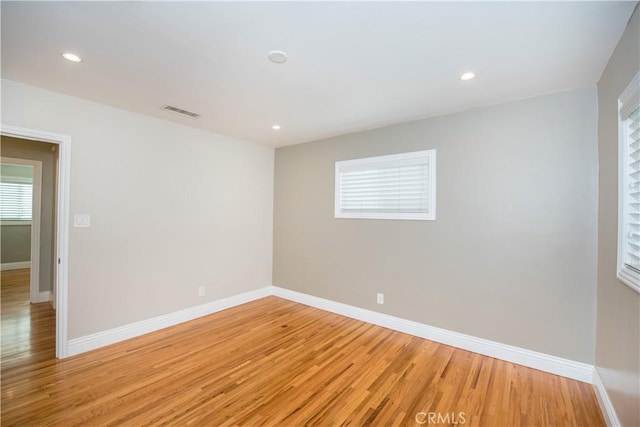 spare room with light wood-type flooring