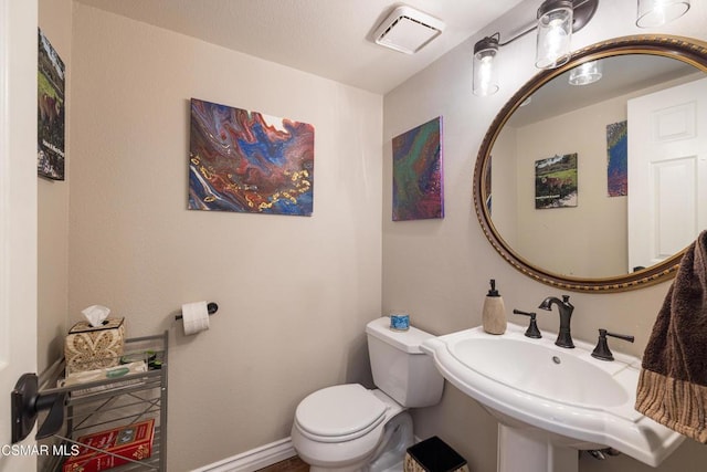 bathroom with sink and toilet