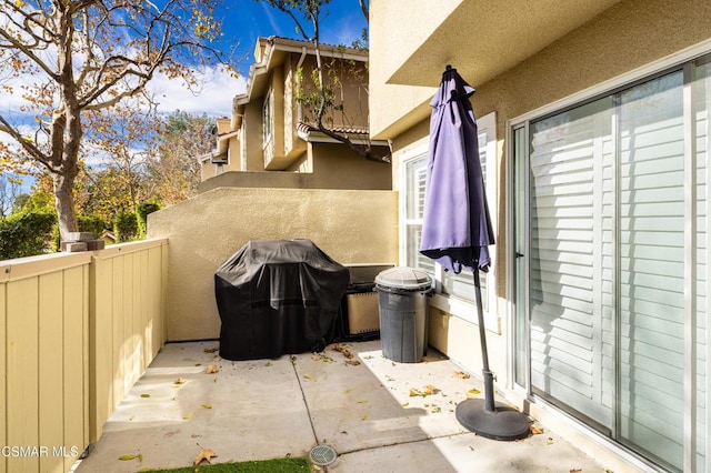 view of patio with a balcony and grilling area