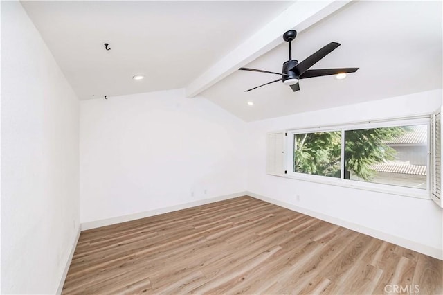 unfurnished room with ceiling fan, light hardwood / wood-style floors, and lofted ceiling with beams