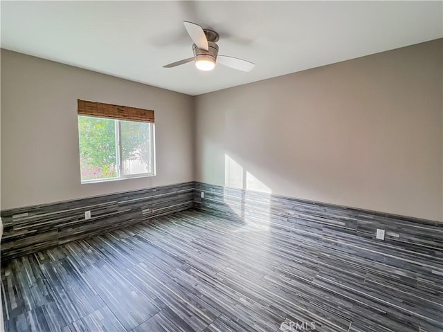 unfurnished room featuring hardwood / wood-style floors and ceiling fan