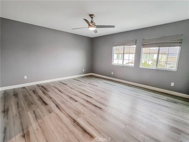 spare room featuring ceiling fan and light wood-type flooring