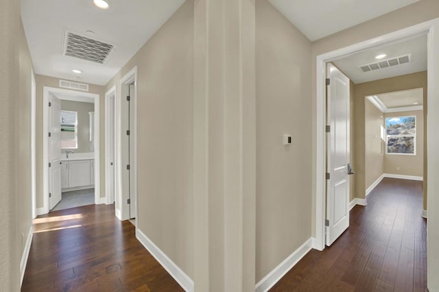 hallway featuring dark hardwood / wood-style flooring