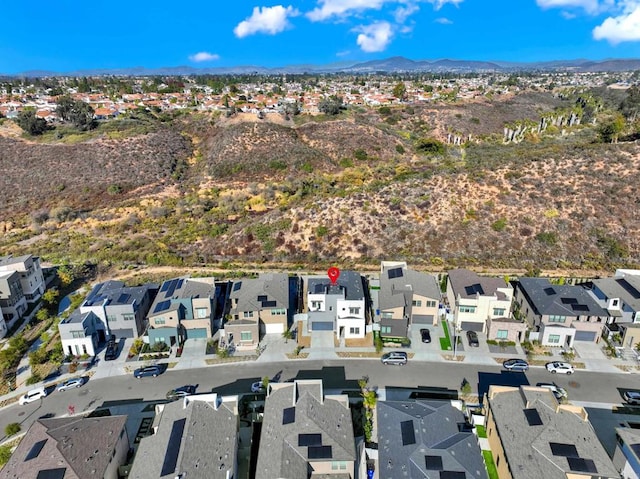 birds eye view of property featuring a mountain view