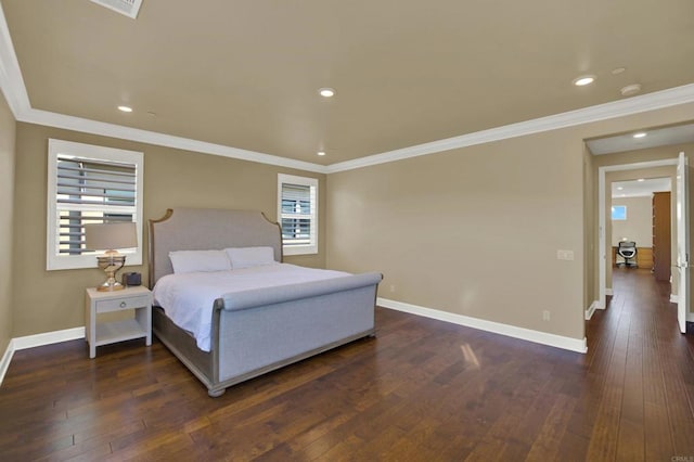 bedroom featuring dark hardwood / wood-style flooring and crown molding