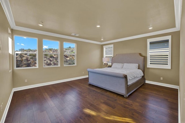 bedroom featuring crown molding and dark hardwood / wood-style floors