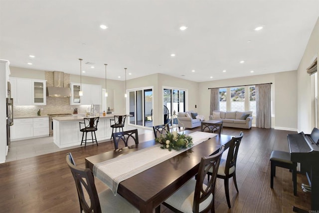 dining space with sink and dark hardwood / wood-style floors