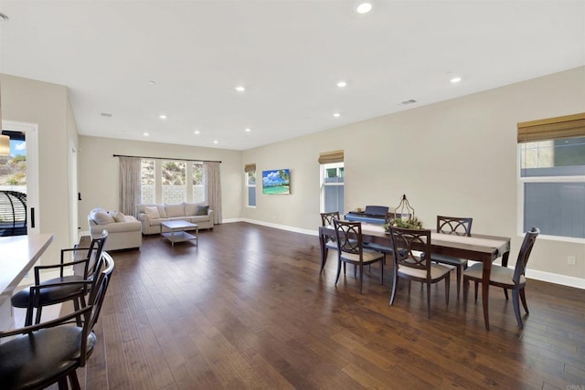 dining area with dark wood-type flooring