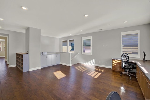 office with dark hardwood / wood-style floors