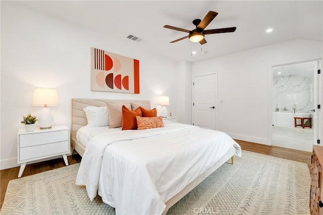 bedroom featuring ceiling fan, wood-type flooring, and vaulted ceiling