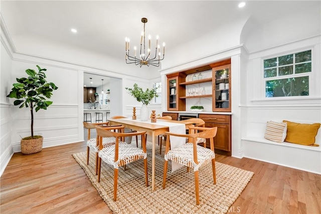 dining space featuring a chandelier and light wood-type flooring