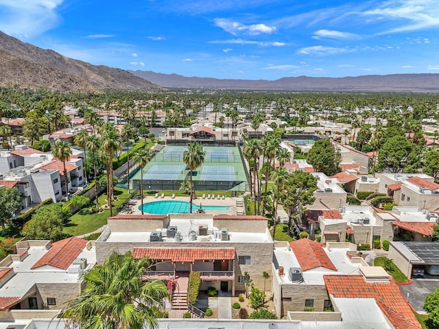 birds eye view of property with a mountain view