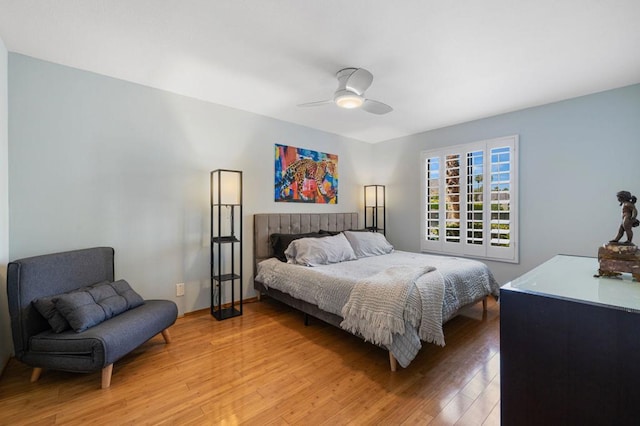 bedroom with ceiling fan and wood-type flooring