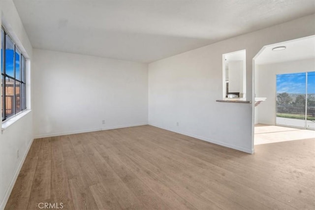 spare room with light wood-type flooring