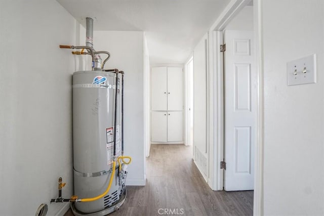 utility room with secured water heater