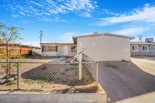 single story home featuring central AC unit