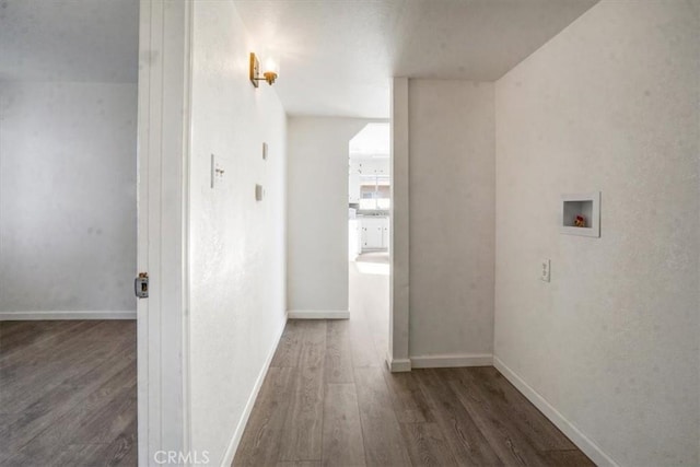 hall with dark wood-type flooring