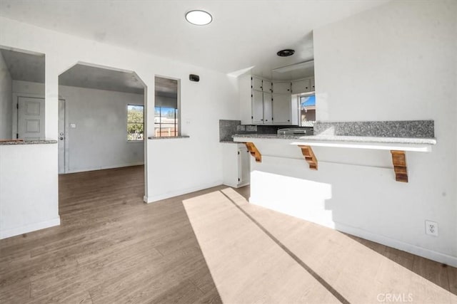 kitchen with hardwood / wood-style floors