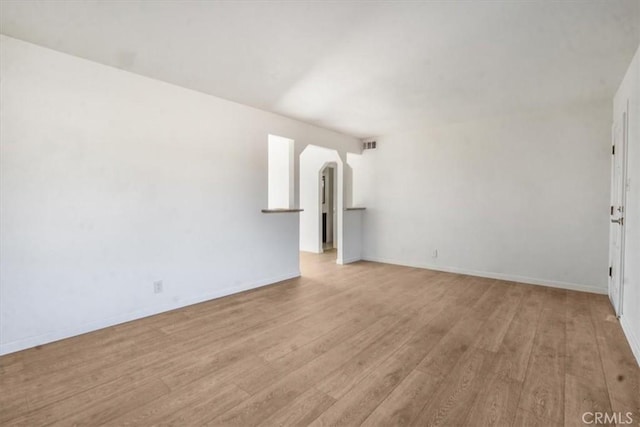 unfurnished living room with light hardwood / wood-style floors