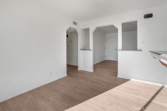 spare room featuring hardwood / wood-style flooring