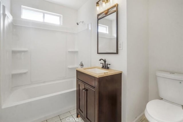 full bathroom with tile patterned floors, vanity, a healthy amount of sunlight, and toilet