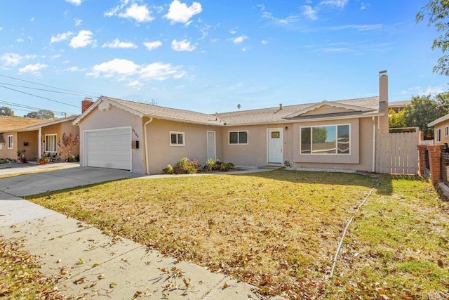 ranch-style house featuring a garage and a front lawn