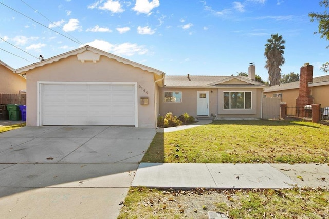 ranch-style home featuring concrete driveway, stucco siding, an attached garage, fence, and a front yard