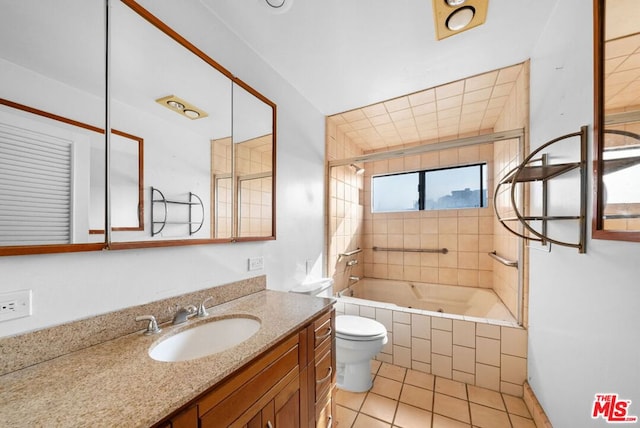 full bathroom with tile patterned floors, vanity, toilet, and tiled shower / bath