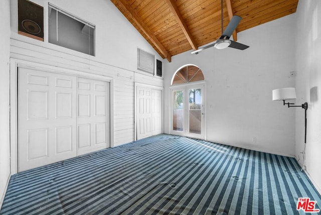 interior space featuring vaulted ceiling with beams, ceiling fan, and wood ceiling