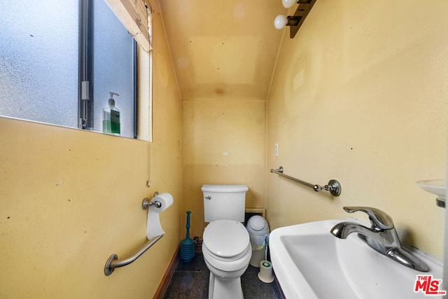 bathroom with tile patterned floors and toilet