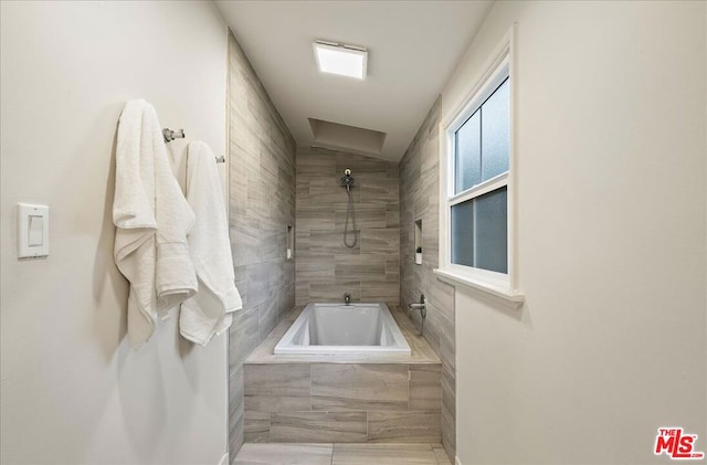 bathroom with tiled tub