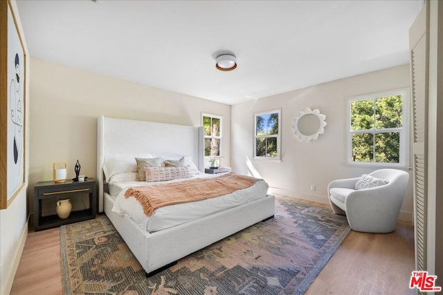 bedroom featuring light wood-type flooring