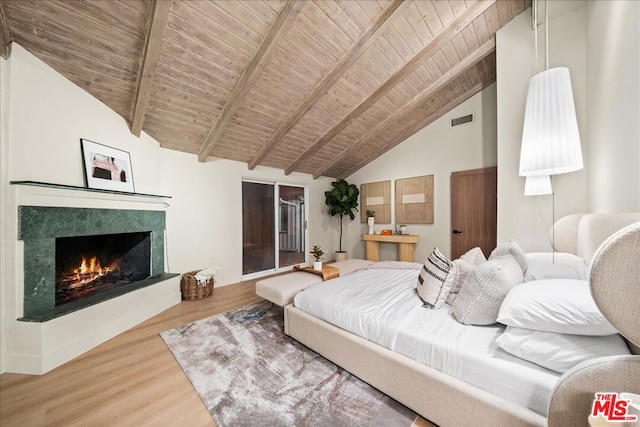 bedroom with wooden ceiling, beamed ceiling, wood-type flooring, and high vaulted ceiling