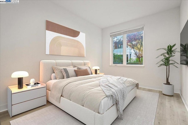 bedroom with light wood-type flooring